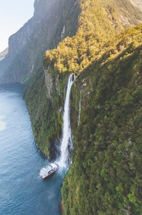 Milford Sound Scenic Cruise getting close to the Stirling Falls waterfall
