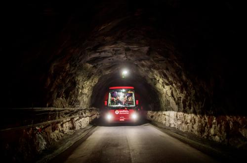 Milford Sound Coach driving through the Homer Tunnel