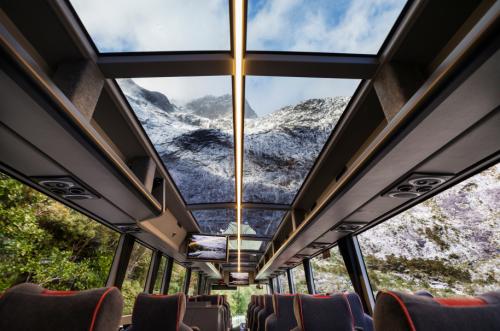 Milford Sound Coach with glass roof view of the Darren Mountains